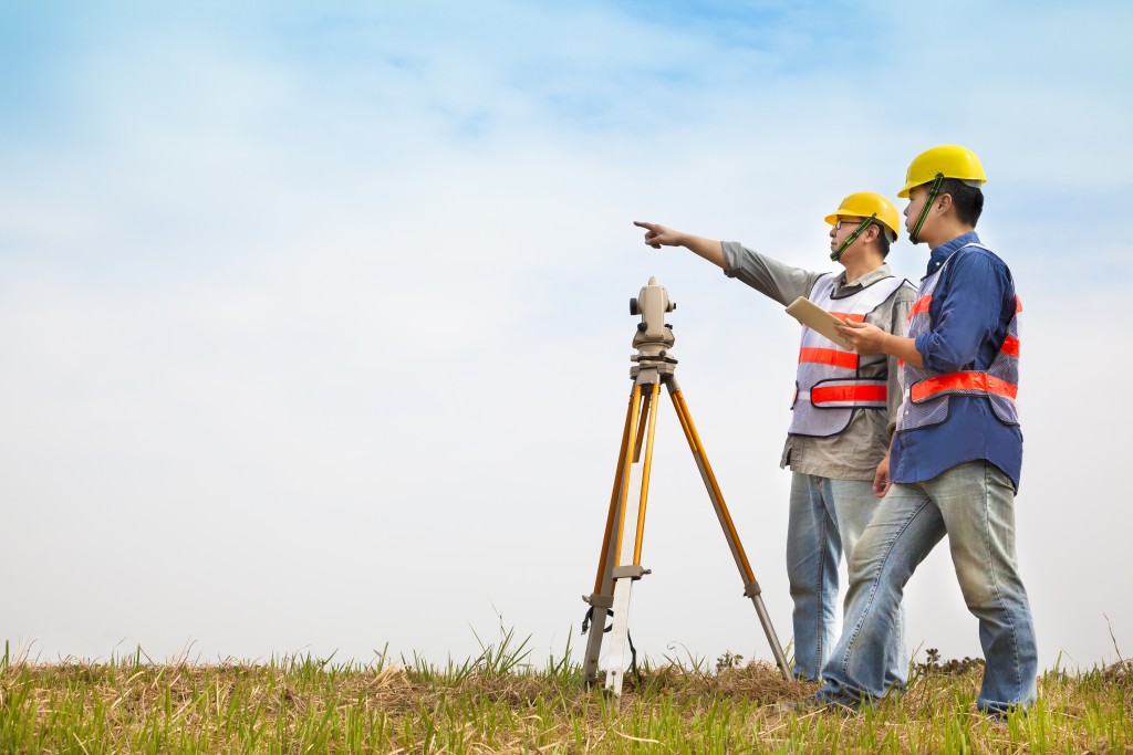 two engineers doing land survey