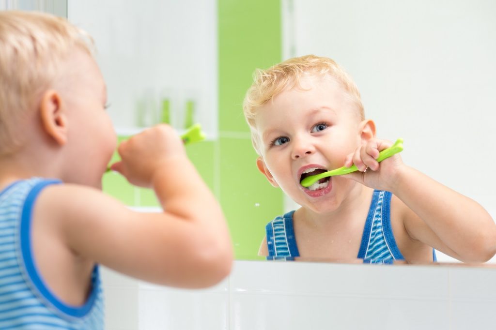 boy kid brushing his teeth