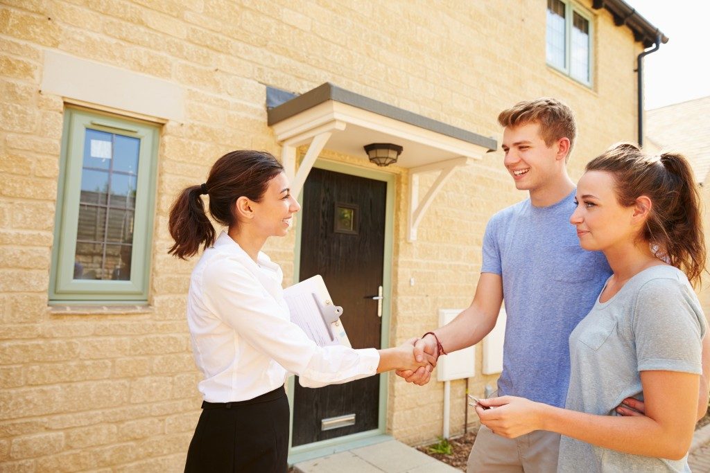 young couple with their new home