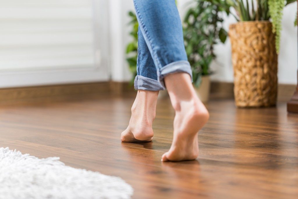 Woman walking barefoot in the living room