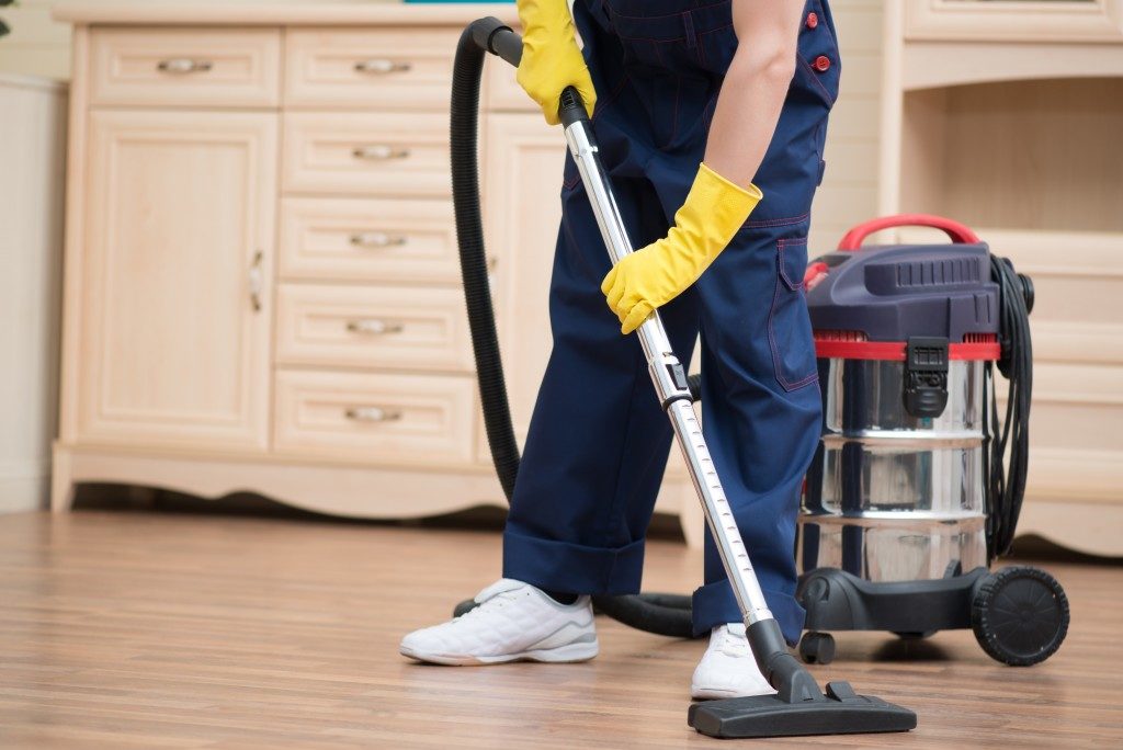 cleaning floors with vacuum