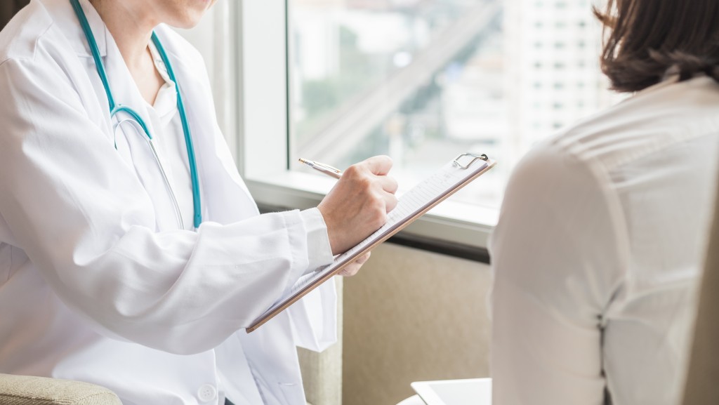 Medical doctor talking to patient