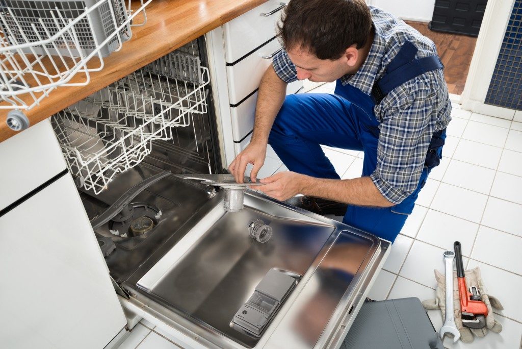 Man fixing the dishwasher