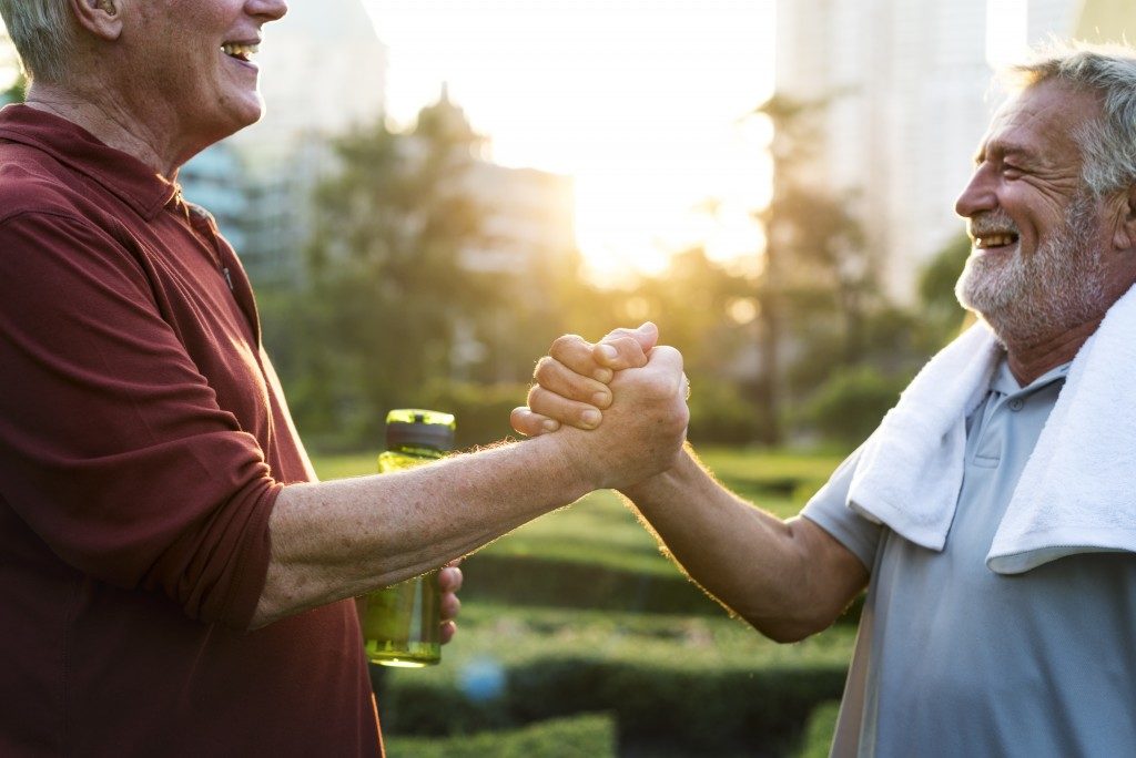 Two elderly men jogging