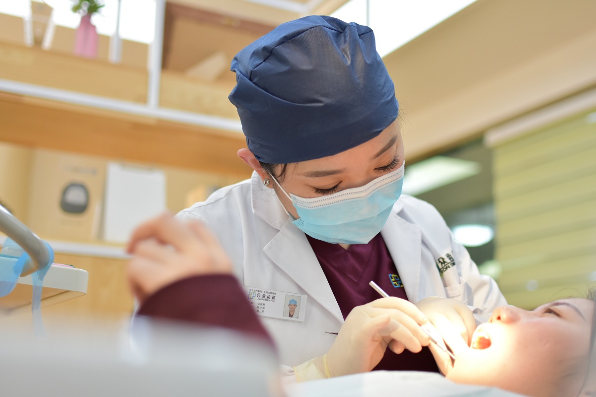 Dentist attending to a patient