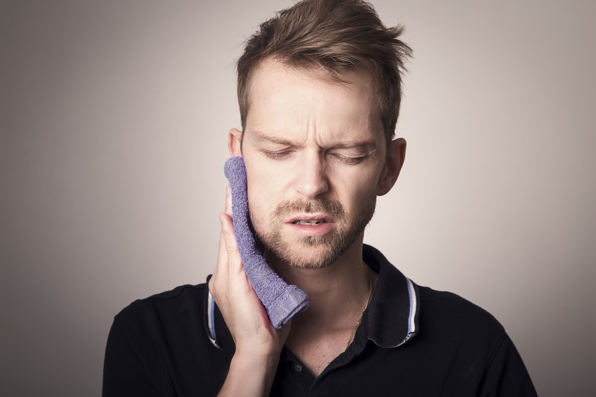 man suffering from toothache