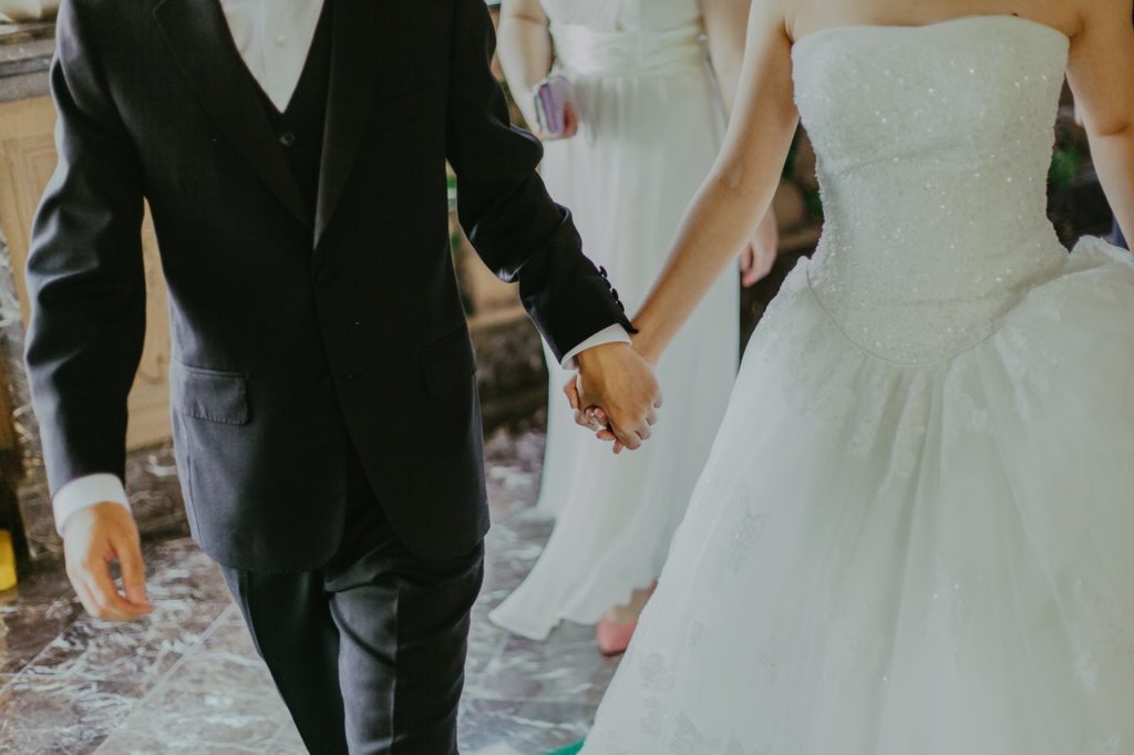 bride and groom hand in hand