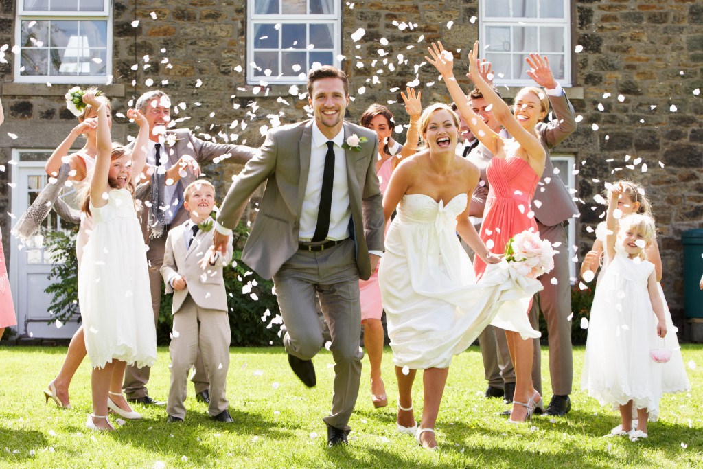 bride and groom running