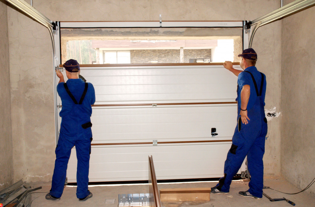 people repairing the garage