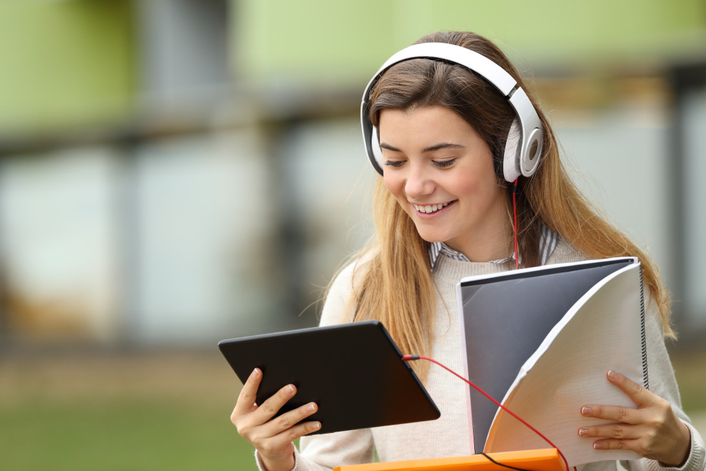 A smiling woman attending an online class