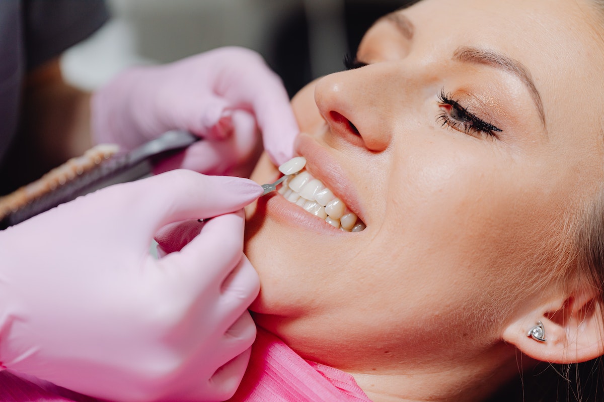 dentist implanting a tooth